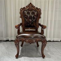 Fauteuil de loisirs en cuir véritable de première qualité de style européen avec accoudoirs sculptés et petite table intégrée pour salon et bureau