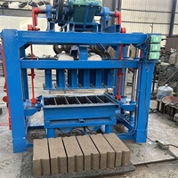 Machine à fabriquer des blocs de béton non cuit QT4-40 à fonctionnement manuel, populaire en Afrique, pour la construction de maisons