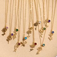 Fleurs de naissance personnalisées plaquées or 18 carats en acier inoxydable élégant de nouveau style avec collier de pierres de naissance colorées
