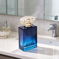 Flacon de parfum bleu dégradé en gros 50ml 1.7oz, base en verre épais, col doré brillant, bouchon arqué, emballage personnalisé