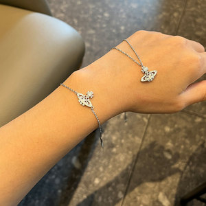 Collar con colgante pequeño de Saturno y copo de nieve hueco con diamantes completos, estilo Imperatriz Viuda, para mujer, cadena de bambú de plata 925, apilable, deportivo, para uso diario - Product Image 1