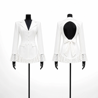 Robe mini blazer tendance pour femme, col à revers, manches longues évasées en dentelle, découpe au dos, nœud, ourlet à volants, simple boutonnage, vente en gros