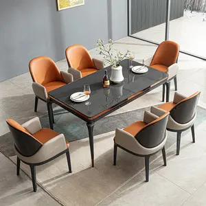 Set di tavoli da pranzo ovali in acciaio inossidabile di alta gamma per mobili da pranzo italiani set di tavoli da pranzo moderni in marmo di lusso a 6 sedie