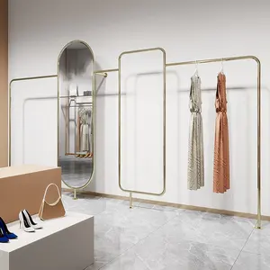 Estante de exhibición para tienda de ropa, mueble montado en la pared con espejo, nuevo diseño, venta al por mayor