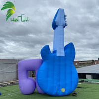 Ballon publicitaire gonflable personnalisé Hongyi 2026 en bâche PVC, modèle guitare musicale avec logo LED