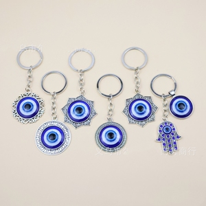 Aleación de Metal Hamsa mano de Fátima ojos <span class=keywords><strong>del</strong></span> <span class=keywords><strong>diablo</strong></span> mal de ojo llavero amuleto buena suerte mal de ojos esmalte encantos decoración colgante joyería - Product Image 1