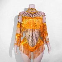 Combinaison de danse sexy à manches longues en spandex/coton, dos nu, en maille transparente, ornée de strass scintillants et de franges, pour costumes de scène et tenues de drag.