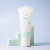 Tube de crème pour le corps en plastique avec tête de massage