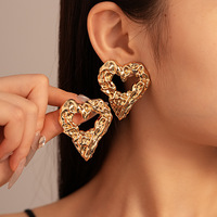 Boucles d'oreilles clous géométriques en alliage plaqué argent pour femmes, style européen et américain, cœur d'amour, style luxe léger exagéré