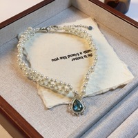 Colliers en perles d'imitation de style français pour femmes, légers et extravagants, avec des gouttes de cristal bleu, chaîne de clavicule, bijoux