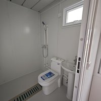 Maison préfabriquée détachable en conteneur, imperméable et isolée thermiquement, adaptée aux conditions météorologiques humides et pluvieuses de l'île de Chiloé
