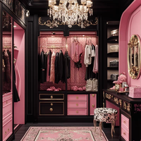 Armoire de chambre à coucher noire, blanche et rose, avec placage bois sculpté, poignée métallique de style mid-century, porte battante, meuble de rangement.