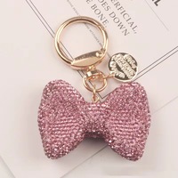 Petit cadeau mignon animal ours porte-clés avec arc et diamant porte-clés en gros Creative Care ours poupée pendentif en métal