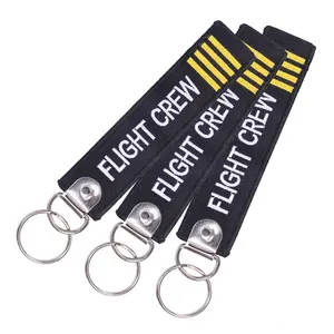 Custom wholesale logo short woven fabric flight jet tag key chains embroidered patch keychains