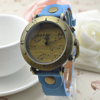Womage-568-1 Montre rétro Womage avec boîtier en alliage, mouvement à quartz, bracelet en cuir, style punk, motif note de musique, vente en gros disponible