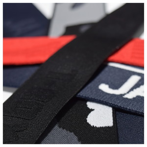 เทปผ้าแจ็คการ์ดแบบยืดหยุ่นสำหรับสวมใส่ภายใต้ผ้าไนลอนอีลาสติกทุกขนาดและสีแพนโทน - Product Image 1