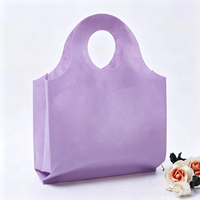 Sac fourre-tout en non-tissé épaissi avec poignée à trous ronds, sac cadeau de boutique haut de gamme, sac de rangement réutilisable pour exposition, vente en gros