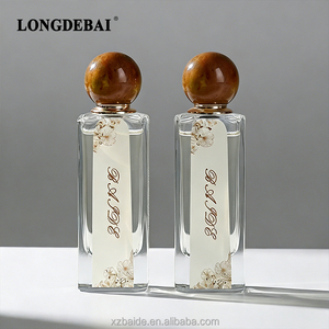 Flacon de parfum en verre écologique personnalisé 75ml 80ml, flacon de parfum vide transparent recyclable à bouchon irrégulier avec capuchon en résine colorée - Product Image 1