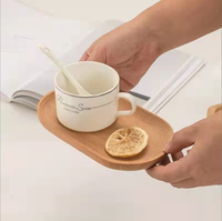 Petite assiette de service ovale en bois d'acacia