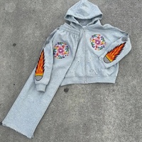 Ensemble de survêtement deux pièces OEM assorti, sweat à capuche zippé et pantalon de survêtement, motif floral large, effet déchiré et ourlet brut