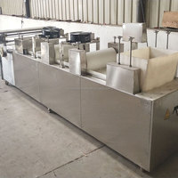 Machine à couper les barres de cacahuètes et de granola Moxin |   Ligne de production automatique de barres de céréales et de nougat