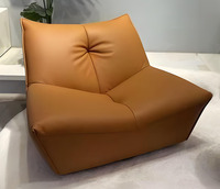 Fauteuil de sol moderne en similicuir PU sans accoudoirs, rembourré en éponge douce, pivotant, résistant à l'eau et facile d'entretien pour salon et chambre à coucher
