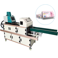Machine automatique de distribution et de scellage de colle thermofusible pour boîtes intérieures, idéale pour l'emballage de biscuits, gâteaux et cartons.