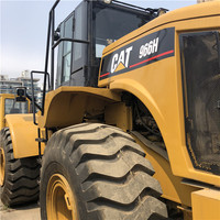 Chargeuse sur pneus Caterpillar 966H d'occasion en stock, prête à être expédiée pour chantier de construction