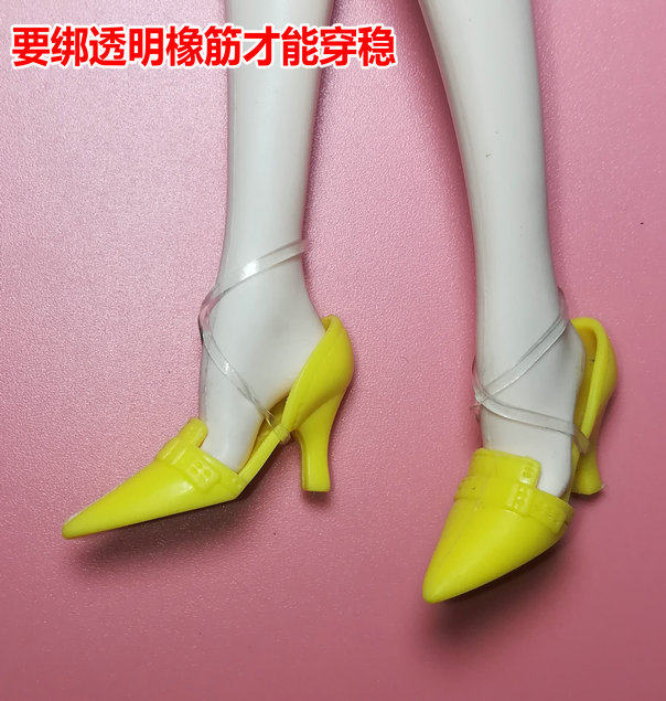 Bright yellow-shoes worn by petite barbie doll as picture