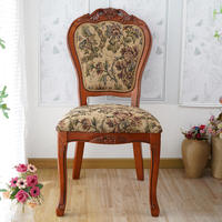 Chaise de salle à manger ergonomique en bois massif sculpté de style européen vintage avec revêtement en tissu floral, mobilier d'appoint rétro pour villa et salon