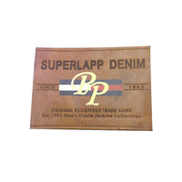 Étiquettes personnalisées en cuir véritable pour vêtements et jeans, avec logo en PP sérigraphié et estampé à chaud, design en cuir de vachette, fabriquées en Chine
