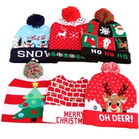 Decorazione della festa di natale ha portato i berretti di Babbo Natale con luce calda lavorata a maglia cappellino per adulti cappelli natalizi con luce a Led