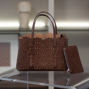 New Style Genuine Leather Unisex Luxury Soft Handbag Romantic Hollow Carved <b>Large</b> Capacity Tote <b>Bag</b> Woven <b>Beach</b> <b>Bag</b> - Product Image 2