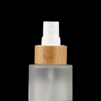 Vente en gros de flacons vaporisateurs en verre mat écologiques de 50 ml, flacons vaporisateurs fins pour parfum avec couvercle en bambou