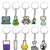 Llaveros al por mayor de goma suave de PVC con diseño de vaso de laboratorio y tubo de ensayo, ideales para niños y adultos, con temática de ciencia y química.