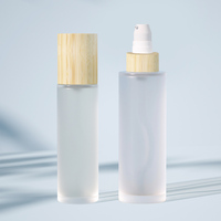Flacon à pompe en verre à bouchon en bambou personnalisé 50ml 100ml 120ml 4oz Flacons compte-gouttes givrés à épaulement plat de 1oz 2oz