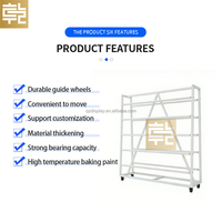 Présentoir sur mesure double face pour rouleaux de tissu, tapis, nappes et cuir, avec roulettes