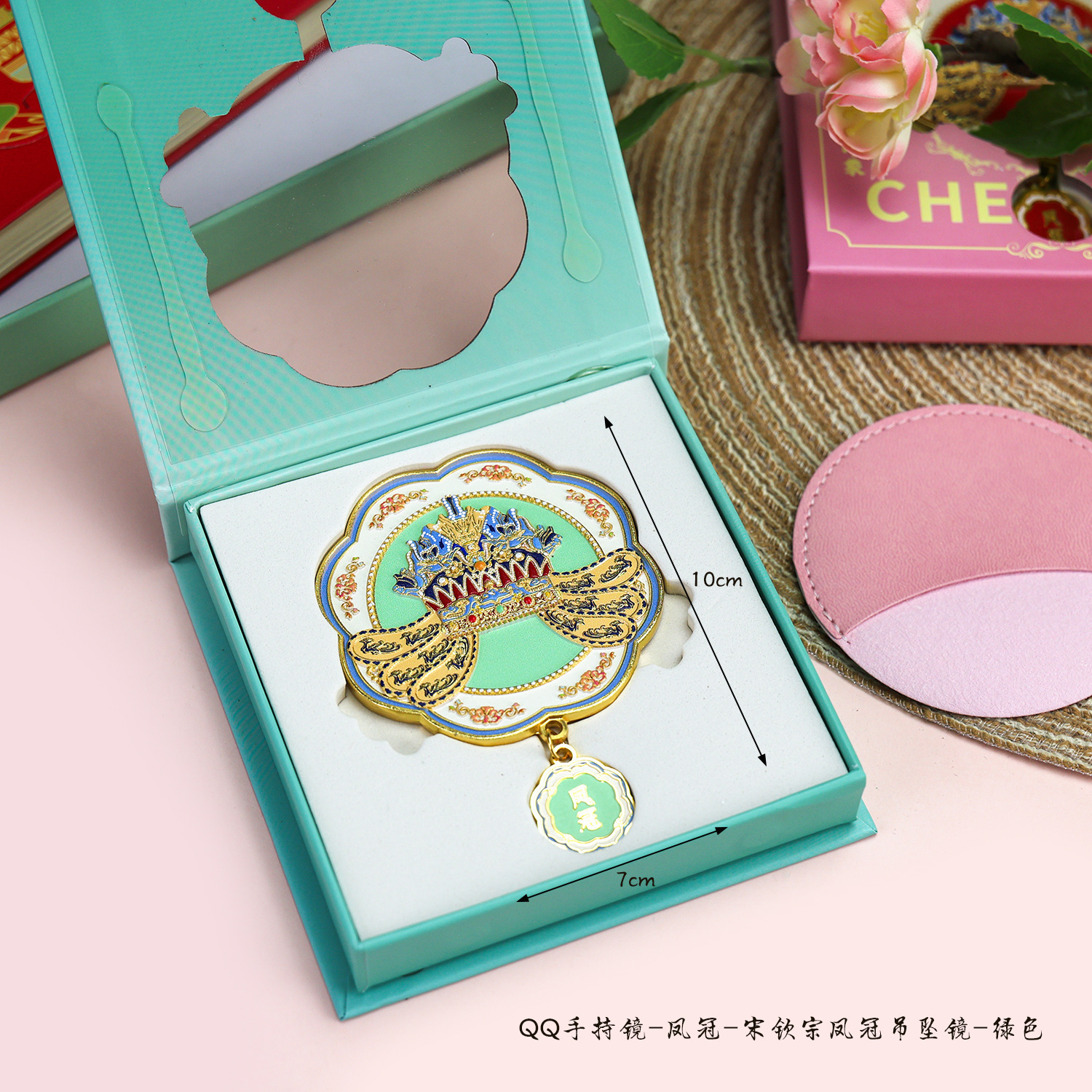 Qq uno specchio pendente con corona di fenice verde