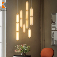 Lustre moderne de petite taille Rakumba Metropol Sebastian Herkner, suspension en verre et fer avec pendentifs en verre