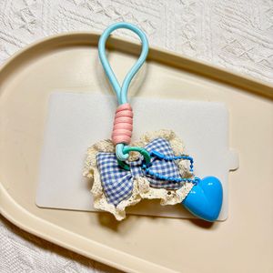 Mengda dolci accessori a quadri con fiocco in pizzo, portachiavi in pizzo, portachiavi con ciondolo a forma di cuore per ragazza. - Product Image 4