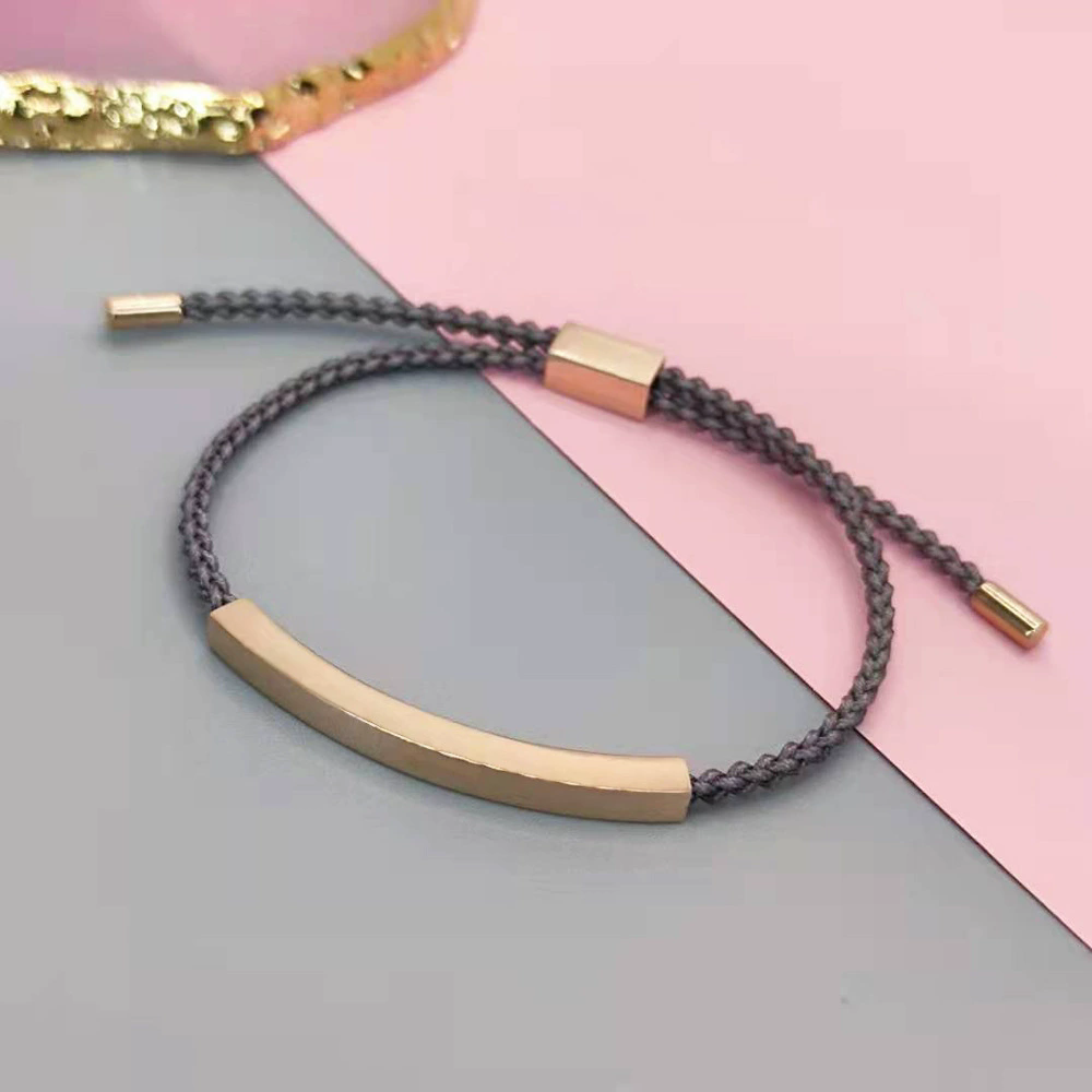 Plaque incurvée en or rose + ficelle grise