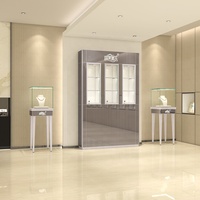 Vitrina moderna de lujo, marco de aluminio acrílico de vidrio templado, luz LED para cosméticos, relojes, teléfonos móviles, centros comerciales