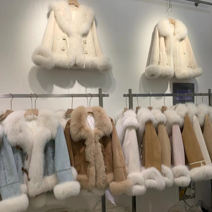 Manteau de fourrure à la mode pour femmes à bas prix en gros, style mi-long intégré en fourrure