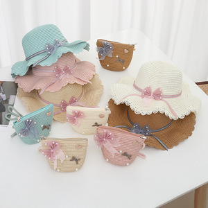 2024 Mùa Hè Trẻ Em Bow Ngọc Trai Ribbon Mũ Cô Gái Bãi Biển Rơm Mũ + Túi Thiết Lập - Product Image 1