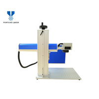 Machine de marquage laser UV Imprimante de date de code QR pour sacs d'emballage alimentaire en plastique en verre Machine de marquage laser en ligne intelligente