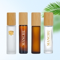 Vente en gros de flacons en verre transparent givré brun vides pour huiles essentielles et parfums, 5 ml, 10 ml, 15 ml, avec bouchon en bambou et bille en métal