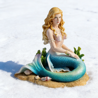Sculpture de sirène en résine artistique, figurine de sirène assise sereine avec détails de coquillages et d'algues