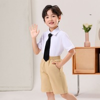 Ensemble chemise et short d'uniforme scolaire en gros d'usine, couleur blanche résistante, chemise à manches courtes grise et short pour élèves du primaire