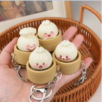 Porte-clés créatif en gros, motif dessin animé mignon, clé de clavier, bouton à pression, expression souriante, anti-stress, avec son clac, en forme de dumpling
