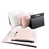 Maßgefertigte Faltbare Koffer-Kleidungs- und Schuhverpackung Rosa Papier Magnetische Geschenkbox mit Gestanztem Griff